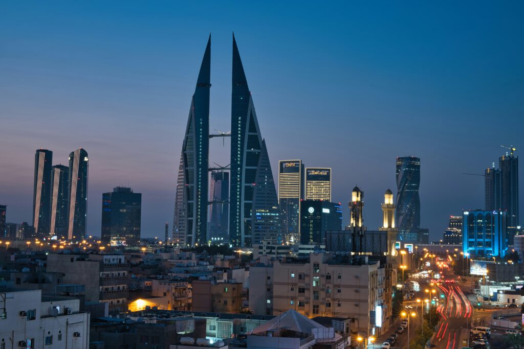 Manama skyline at dusk with the Bahrain World Trade Center